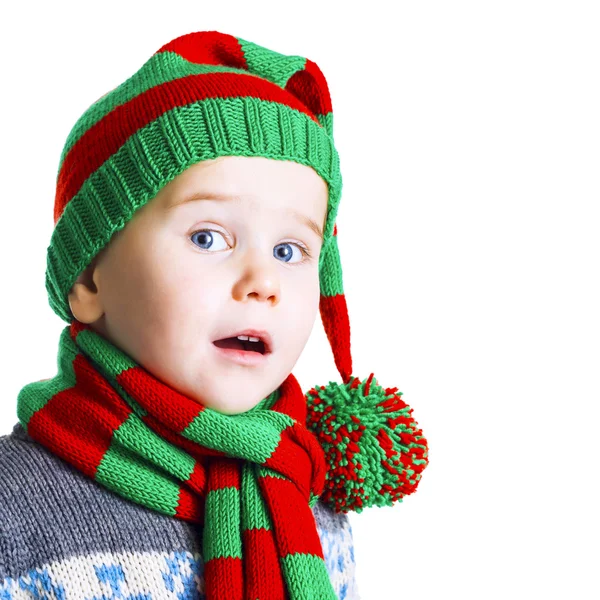 Christmas boy in knitted cloths sings a Christmas song — Stock Photo, Image