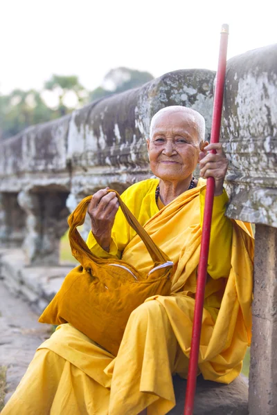 Female monk dressed in orange toga — Stock Photo, Image