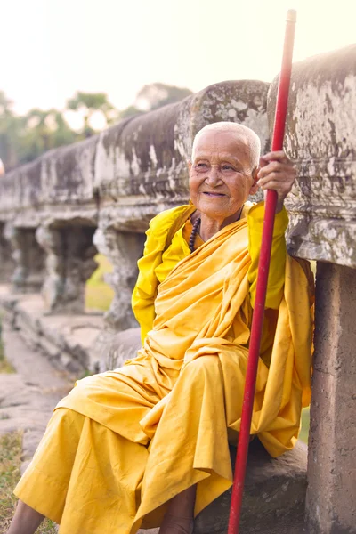 Female monk dressed in orange toga — Stock Photo, Image