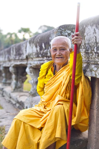 Female monk dressed in orange toga — Stock Photo, Image