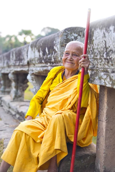 Female monk dressed in orange toga — Stock Photo, Image