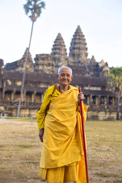 Female monk dressed in orange toga — Stock Photo, Image