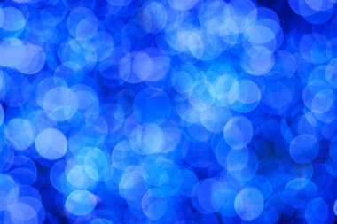 Blue abstract background of blurred lights clipart