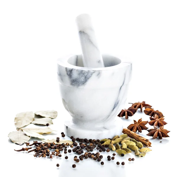 Marble mortar and pestle with assorted spices — Stock Photo, Image