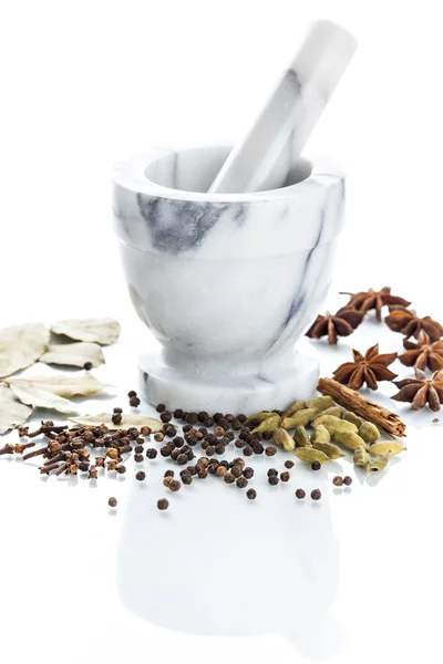 Marble mortar and pestle with assorted spices — Stock Photo, Image