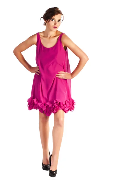 Молода і сексуальна жінка модель в рожевій сукні позує — стокове фото