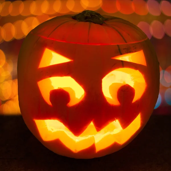 Carved lit Halloween pumpkin — Stock Photo, Image