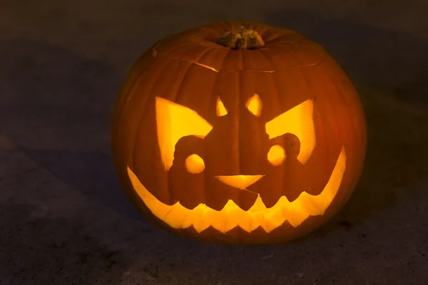 Carved lit Halloween pumpkin — Stock Photo, Image