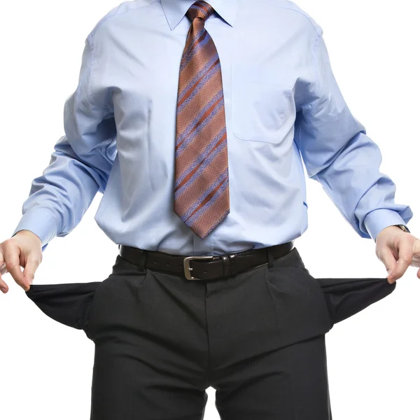 Businessman showing empty pockets — Stock Photo, Image