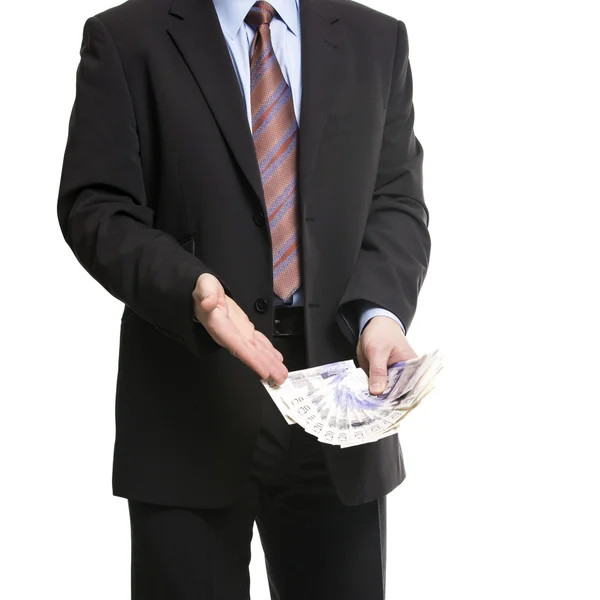 Businessman in dark suit shows a Spread of 20 British Pounds Ste — Stock Photo, Image