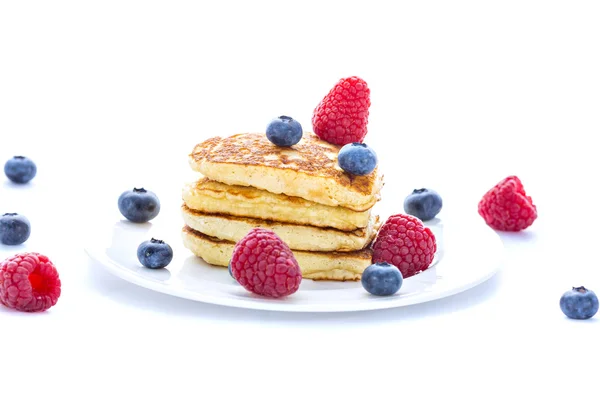 Pile of heart shaped pancakes with blueberries and raspberries — Stock Photo, Image