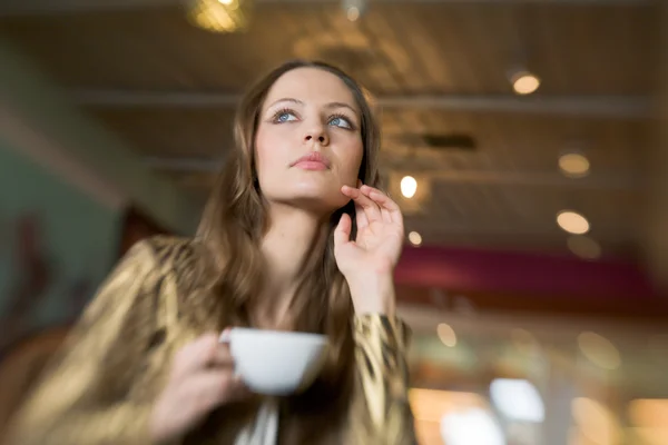 Beautiful Girl Drinking Tea or Coffee in Cafe — Stock Photo, Image