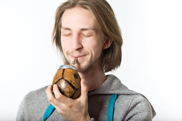 Portrait of young man with long blond hair on a white background — Stock Photo, Image