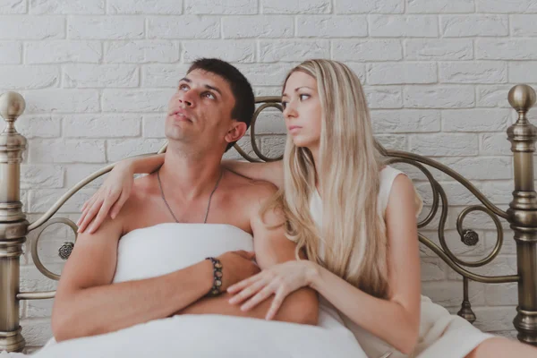 Young attractive happy amorous couple in bedroom — Stock Photo, Image