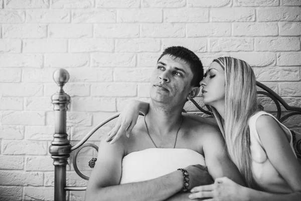 Young attractive happy amorous couple in bedroom — Stock Photo, Image