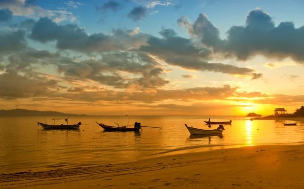 A beautiful landscape, sunset at sea and fishing boats Stock Picture