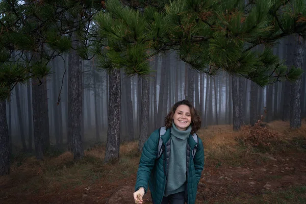 Young Happy Woman Traveler Green Jacket Backpack Foggy Pine Forest — Stock Photo, Image