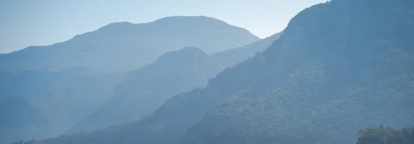 Beautiful landscape, blue mountain hills in the fog, banner format — Stock Photo, Image