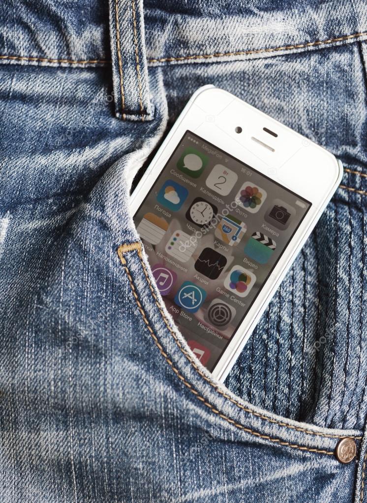 White Apple iPhone 4s, in a jeans pocket. Editorial image, 2 september 2014, Russia, Moscow