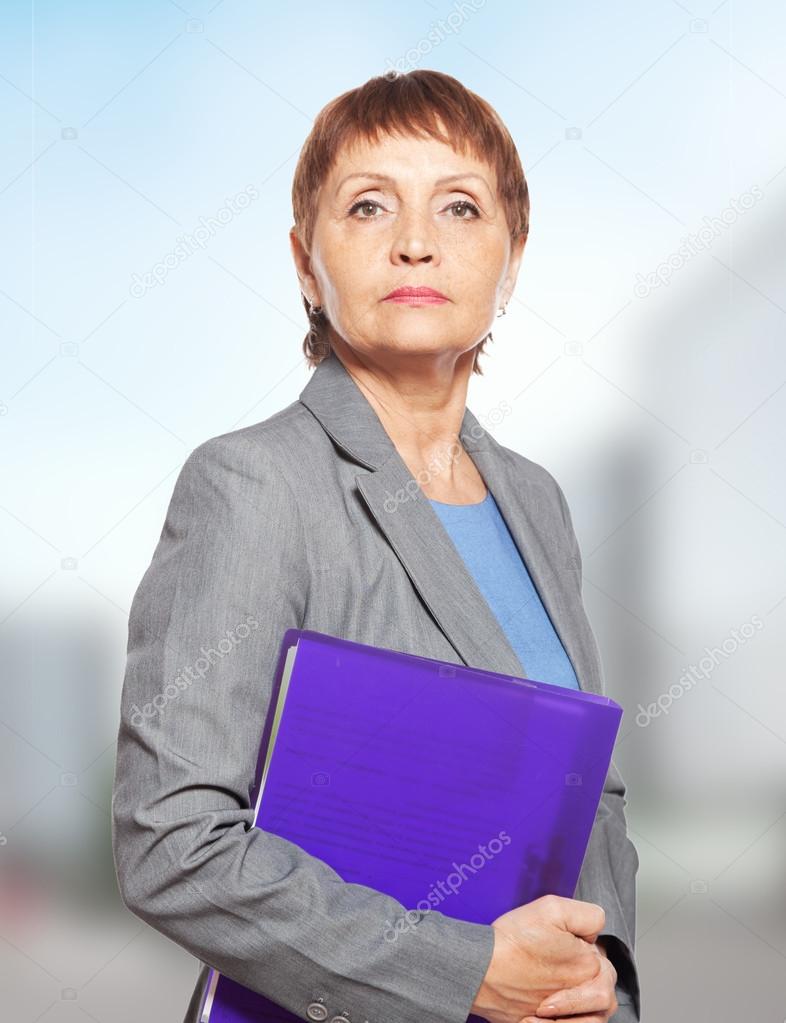 attractive woman 50 years old with a folder for documents — Stock Photo