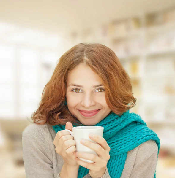 Young woman in blue scarf with white mug — Stock Photo, Image