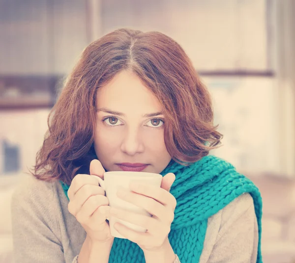 Young woman in blue scarf with white mug — Stock Photo, Image