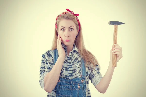 Attractive young woman with a hammer and a screwdriver, image wi — Stock Photo, Image