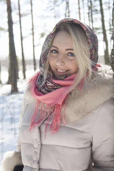 Blonde in the winter forest against the sky — Stock Photo, Image