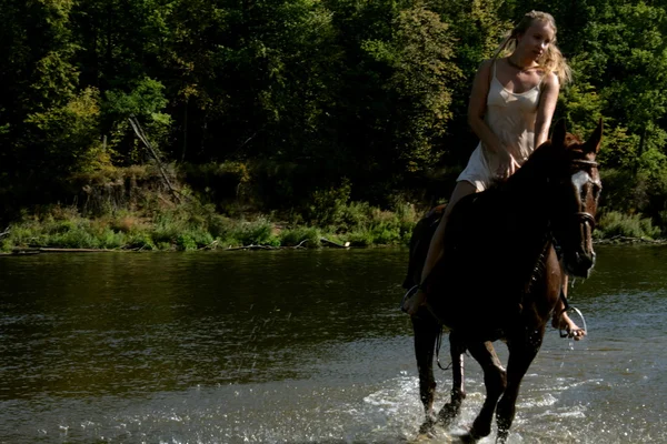 Blond rider on the horse — Stock Photo, Image