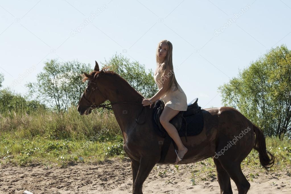 blond rider on the horse