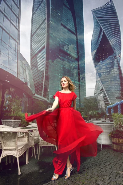 Elegant woman in red long dress — Stock Photo, Image