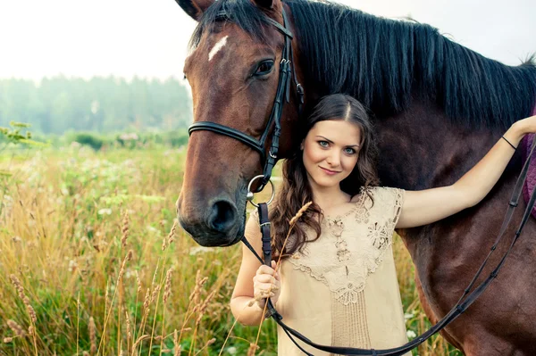 Pretty woman with horse — Stock Photo, Image