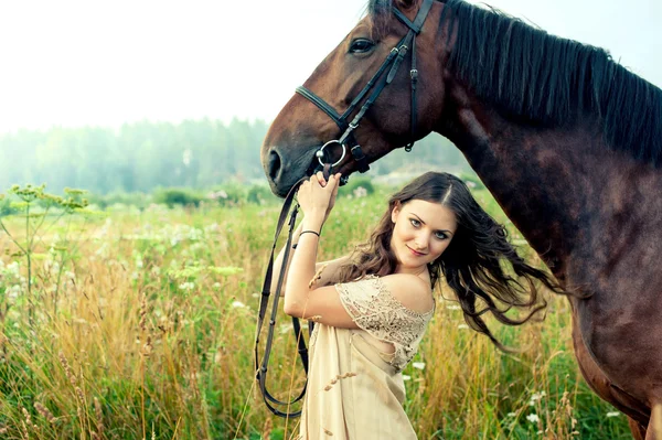 Pretty woman with horse — Stock Photo, Image