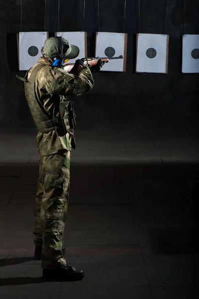 Man shooting with rifle