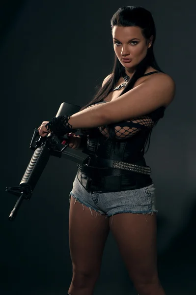 Girl with machine gun — Stock Photo, Image