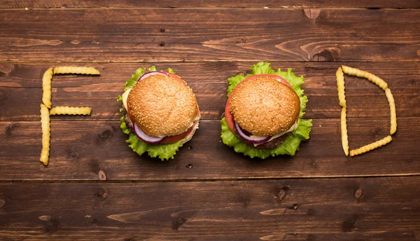 Hamburguesas formando comida de palabra —  Fotos de Stock