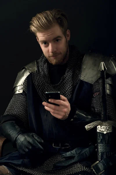 Ancient knight with mobile phone — Stock Photo, Image