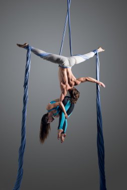 couple performing aerial ribbons dance