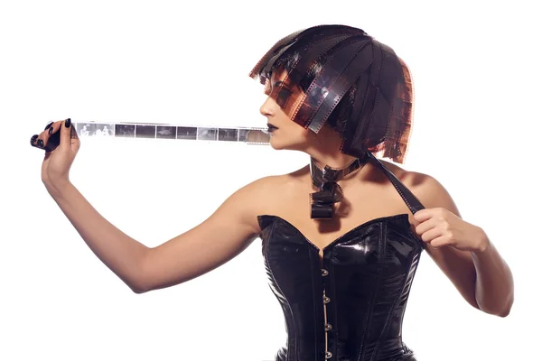 Woman in leather corset and filmstrips wig — Stock Photo, Image
