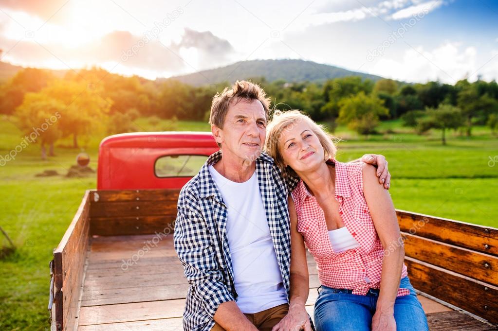 Senior couple in pickup truck Stock Photo by ©halfpoint 103597058