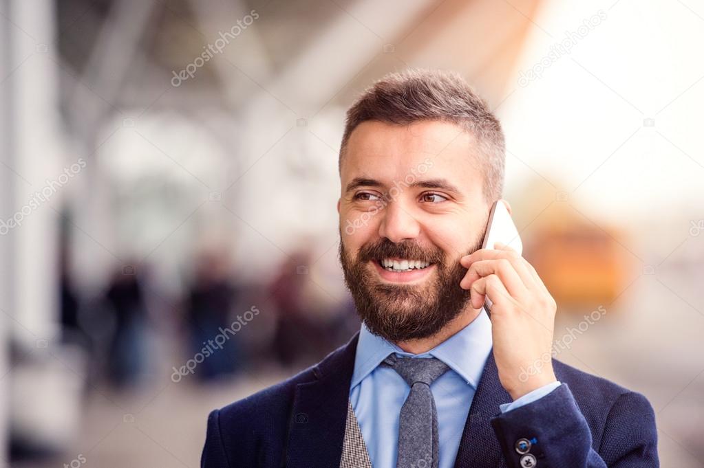 Hipster businessman making phone call
