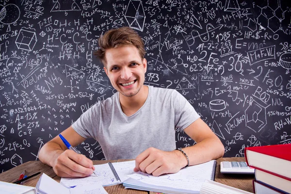 Hipster student doing his homework — Stock Photo, Image