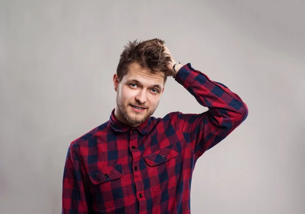 Hipster man in checked shirt smiling — Stock Photo, Image