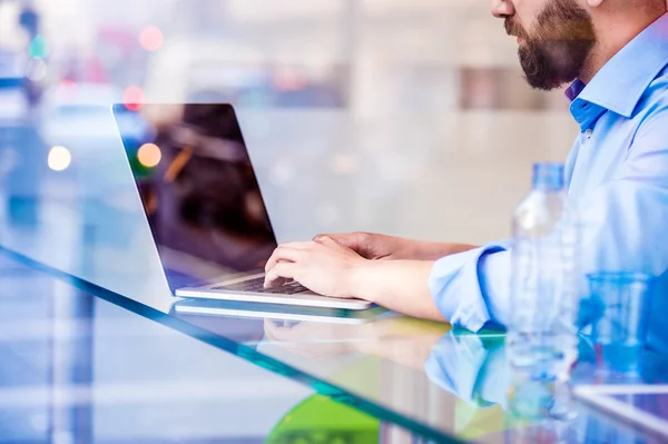 Hipster manager in cafe with laptop — Stock Photo, Image