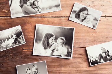 Mothers day composition. Black-and-white pictures, wooden backgr clipart