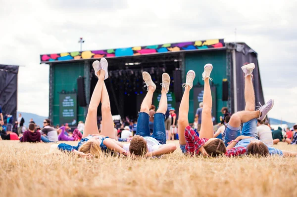 Legs of teenagers at music festival — Stock Photo, Image