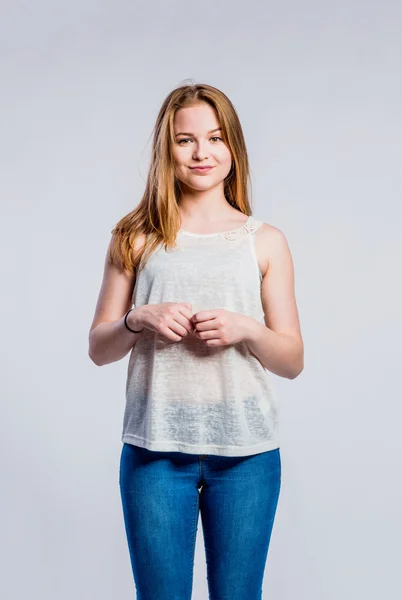 Girl in jeans and singlet, young woman, studio shot — Stock Photo, Image