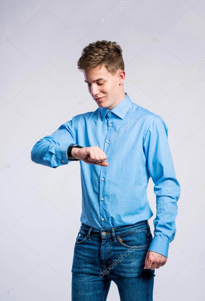 Boy in jeans and t-shirt, young man, studio shot — Stock Photo