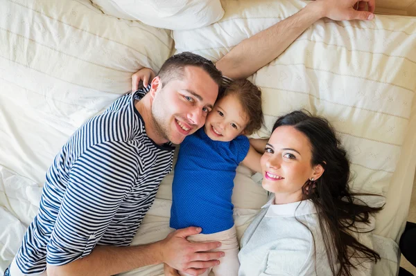 Parents having fun with their cute little daughter — Stock Photo, Image