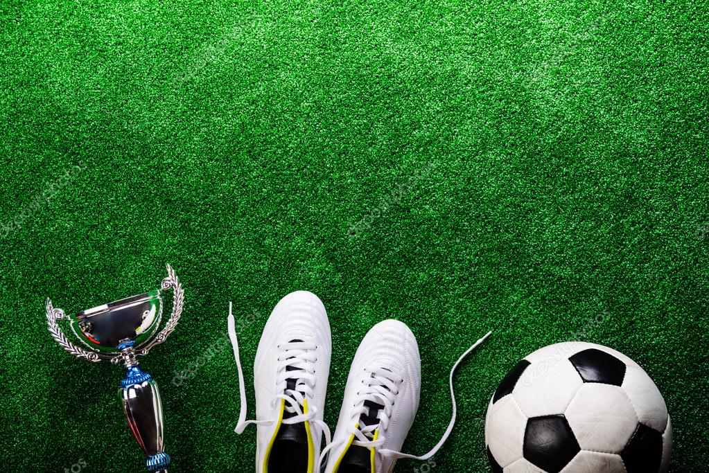 Soccer ball, boots and trophy Stock Photo by ©halfpoint 112332344